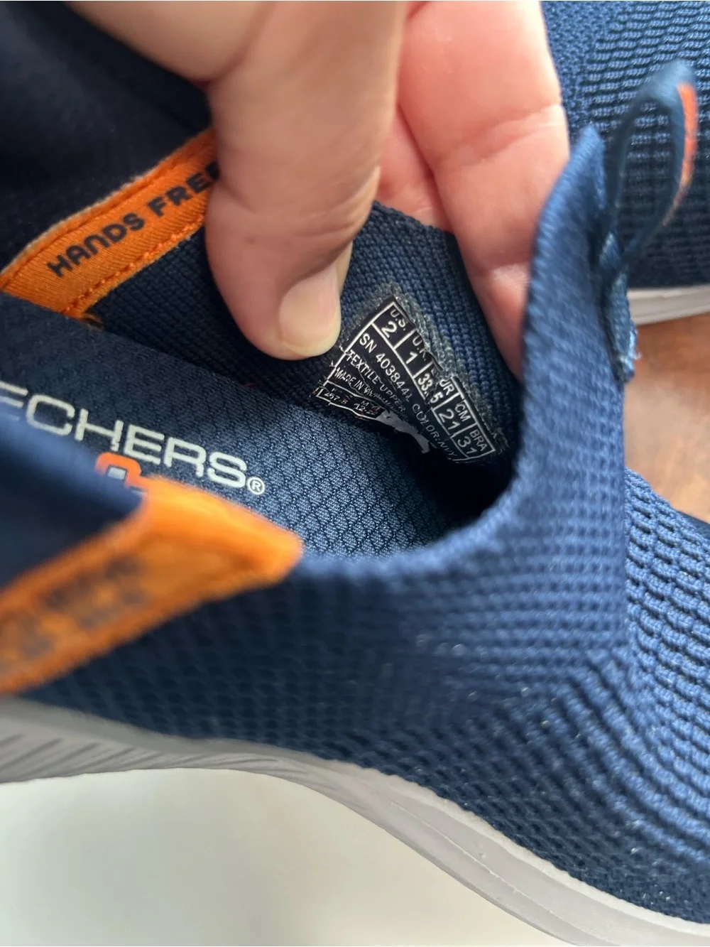 Skechers Kids Navy Slip-On Knit Sneakers with Orange Tabs